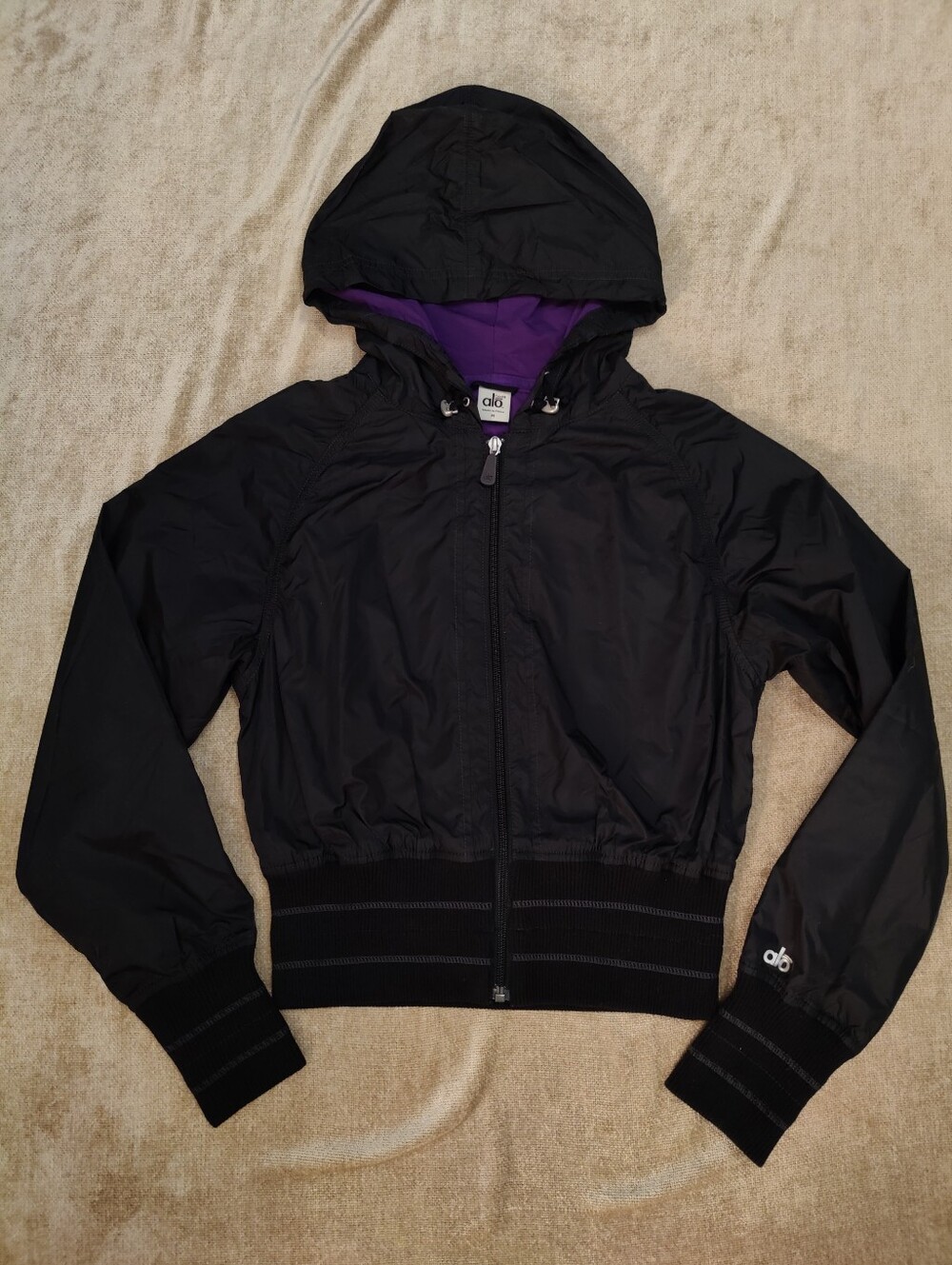 Alo CoolFit Hooded Jacket – Black Nylon with Purple Cotton Blend Lining (Size M)